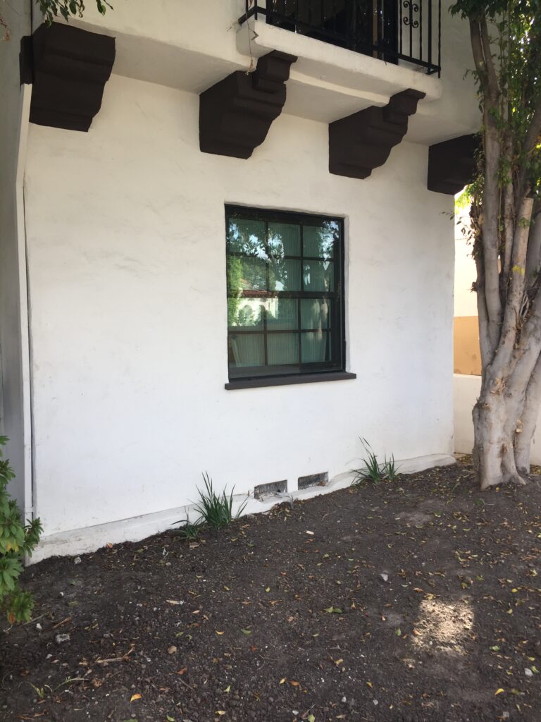 Exterior of house in noisy neighborhood with attractive soundproof windows installed