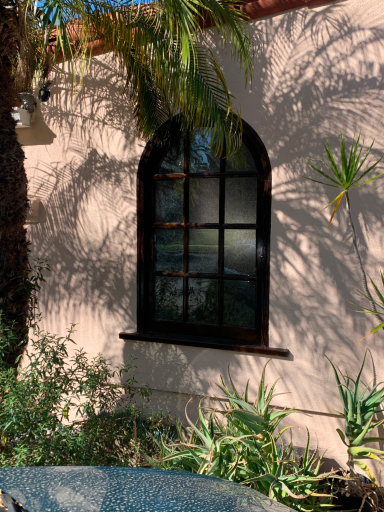 Historic window viewed from the exterior of a spanish colonial style home