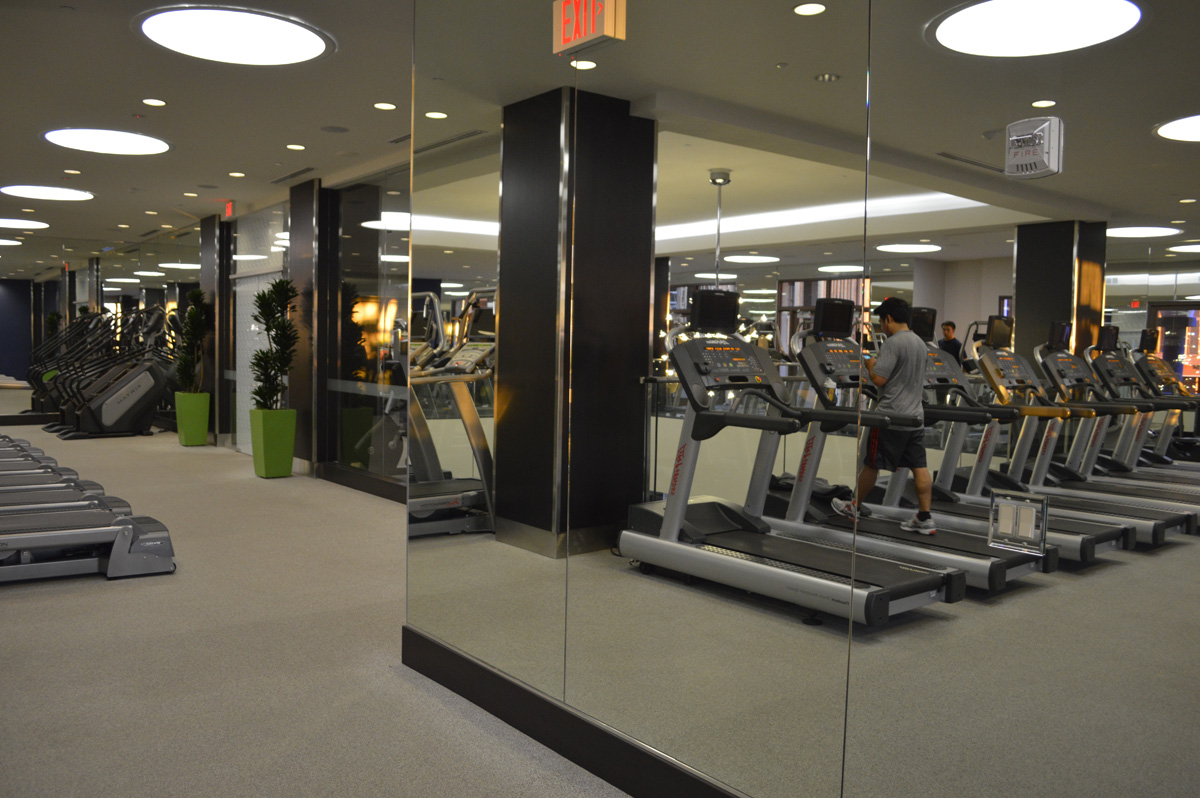 Exciting looking mirrored walls make a dynamic addition to a well-equipped gym