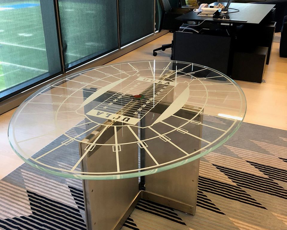 Round glass tabletop of thick etched glass oozes an upscale character 