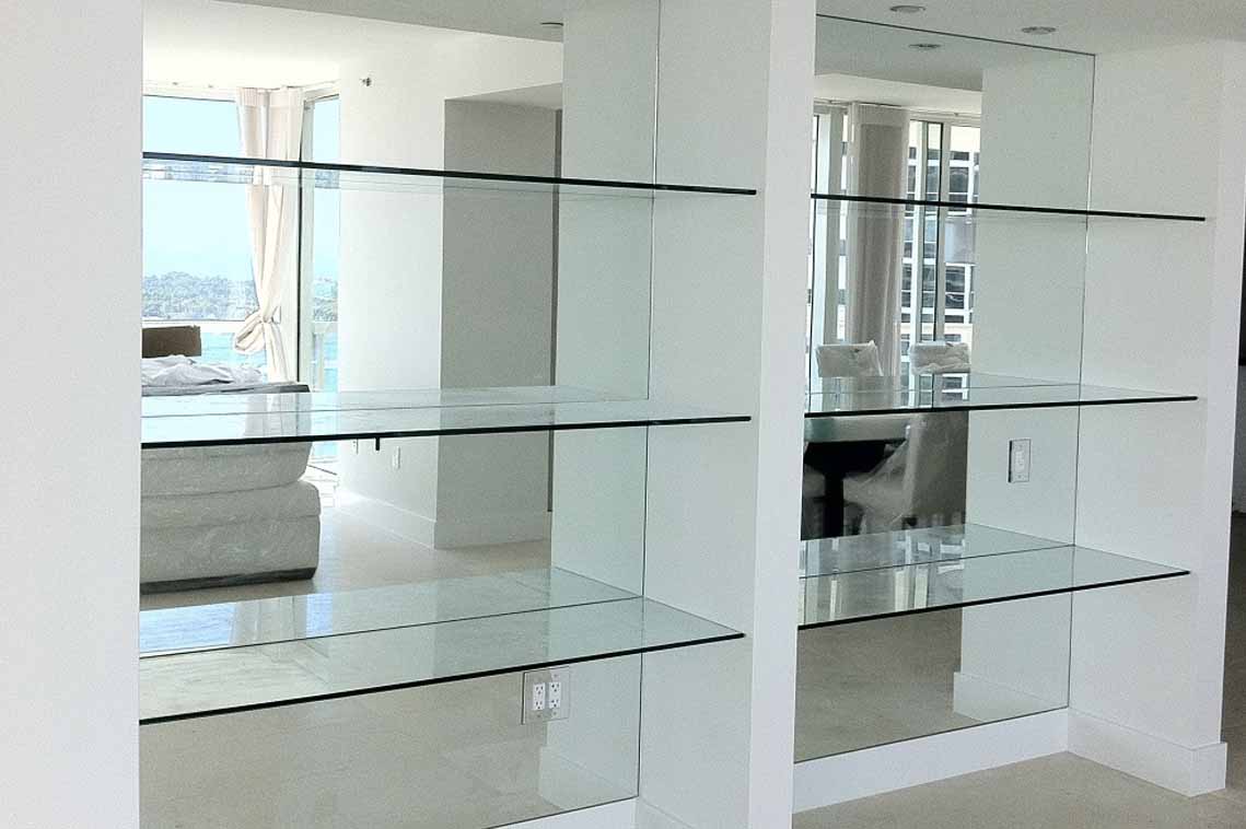 Glass shelving installation provides function with elegance.