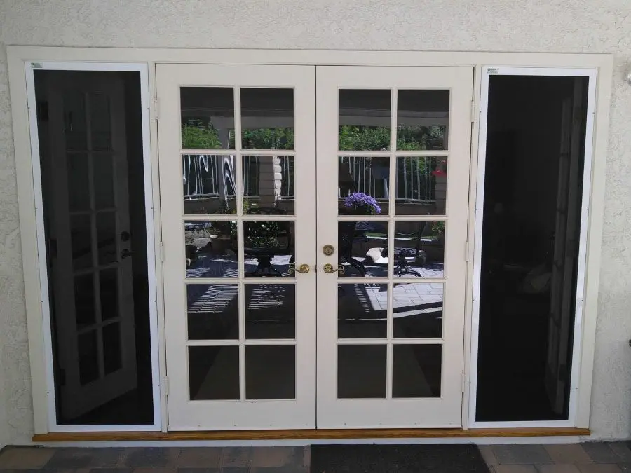 Double patio doors secured by presence of vista security screens on windows and doors
