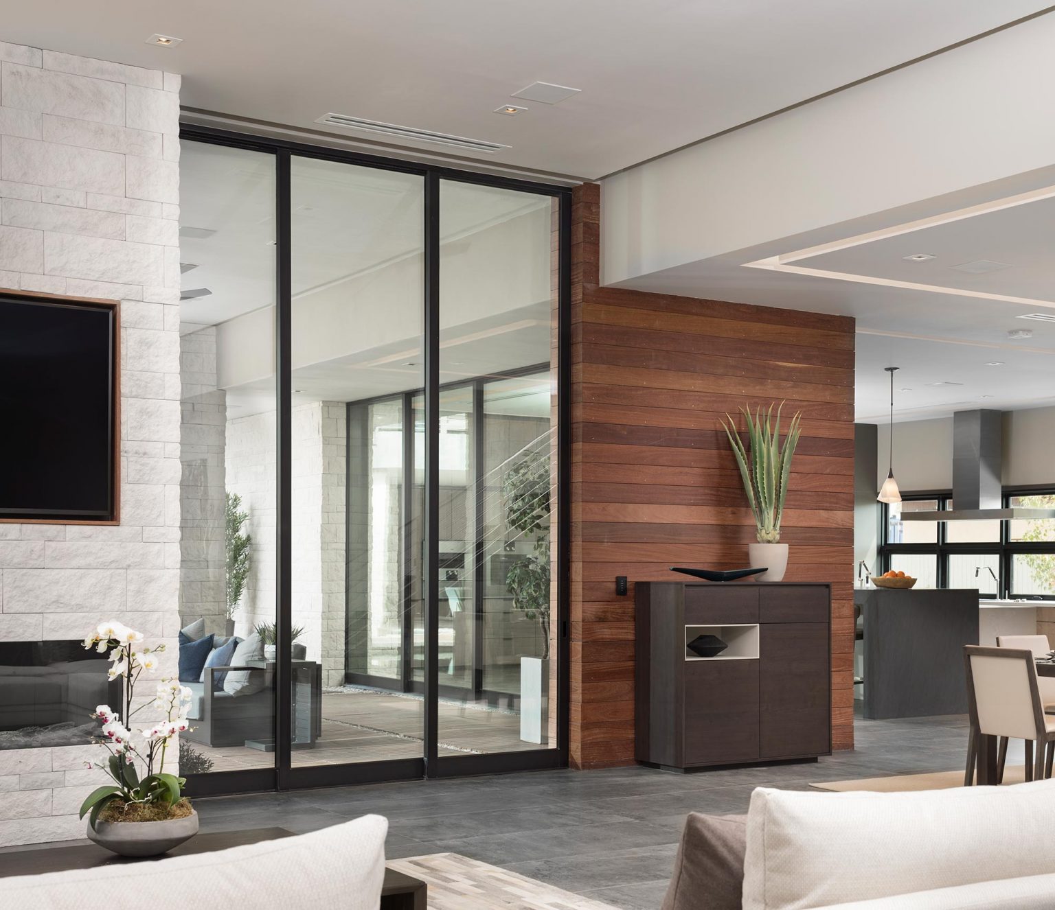 Sliding Doors in modern family room are used to separate one room from another.
