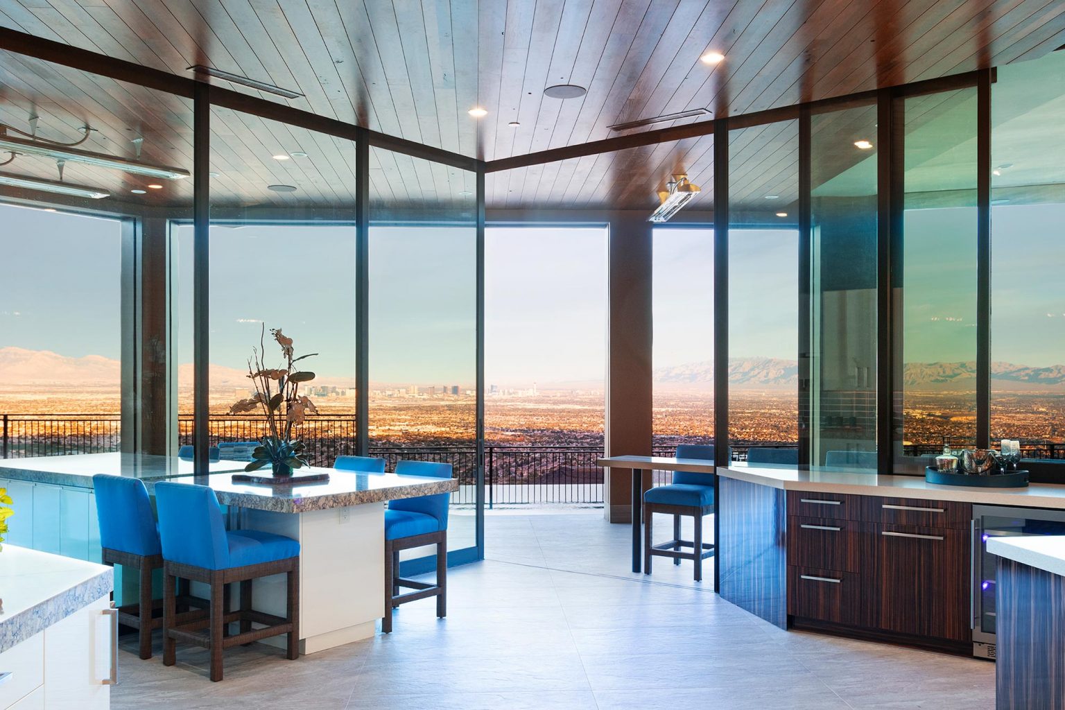 Sliding & Multi-Slide Doors are opened in plush living room space to see a vista of downtown