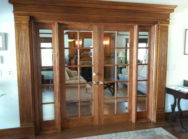Elegant wooden French doors with glass panes.
