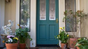 A picture of a porch with an energy efficient door showing Sustainable & Energy Saving Solutions.